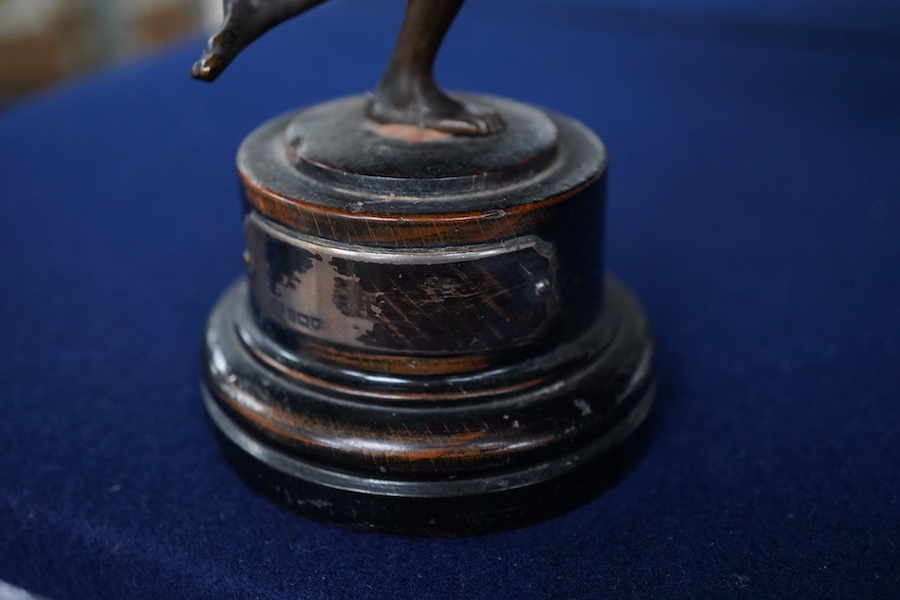 A bronze study of a classical discus thrower with silver mounted plaque to the base, 17cm high